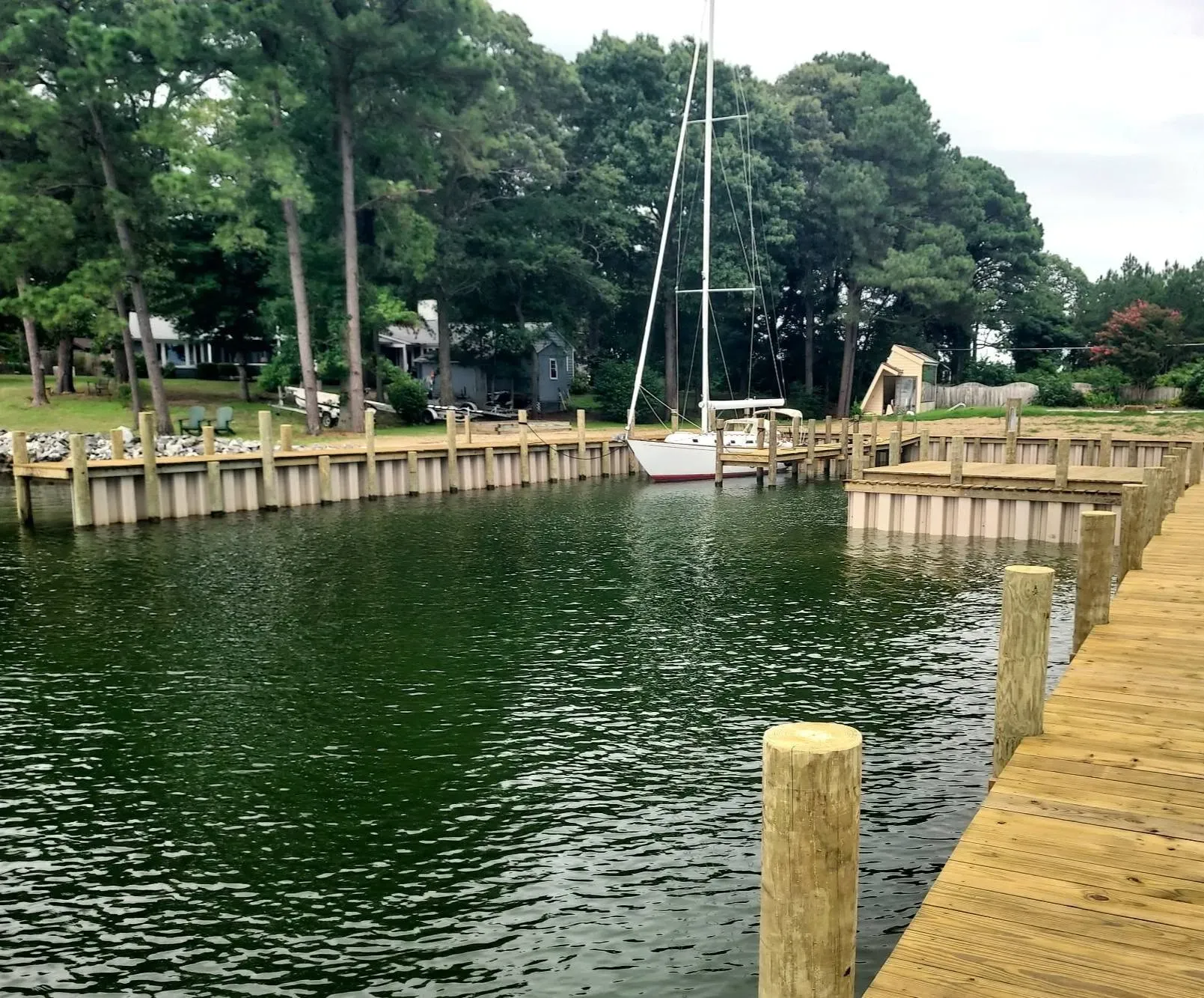 Bulkheaded cove with a sailboat moored inside