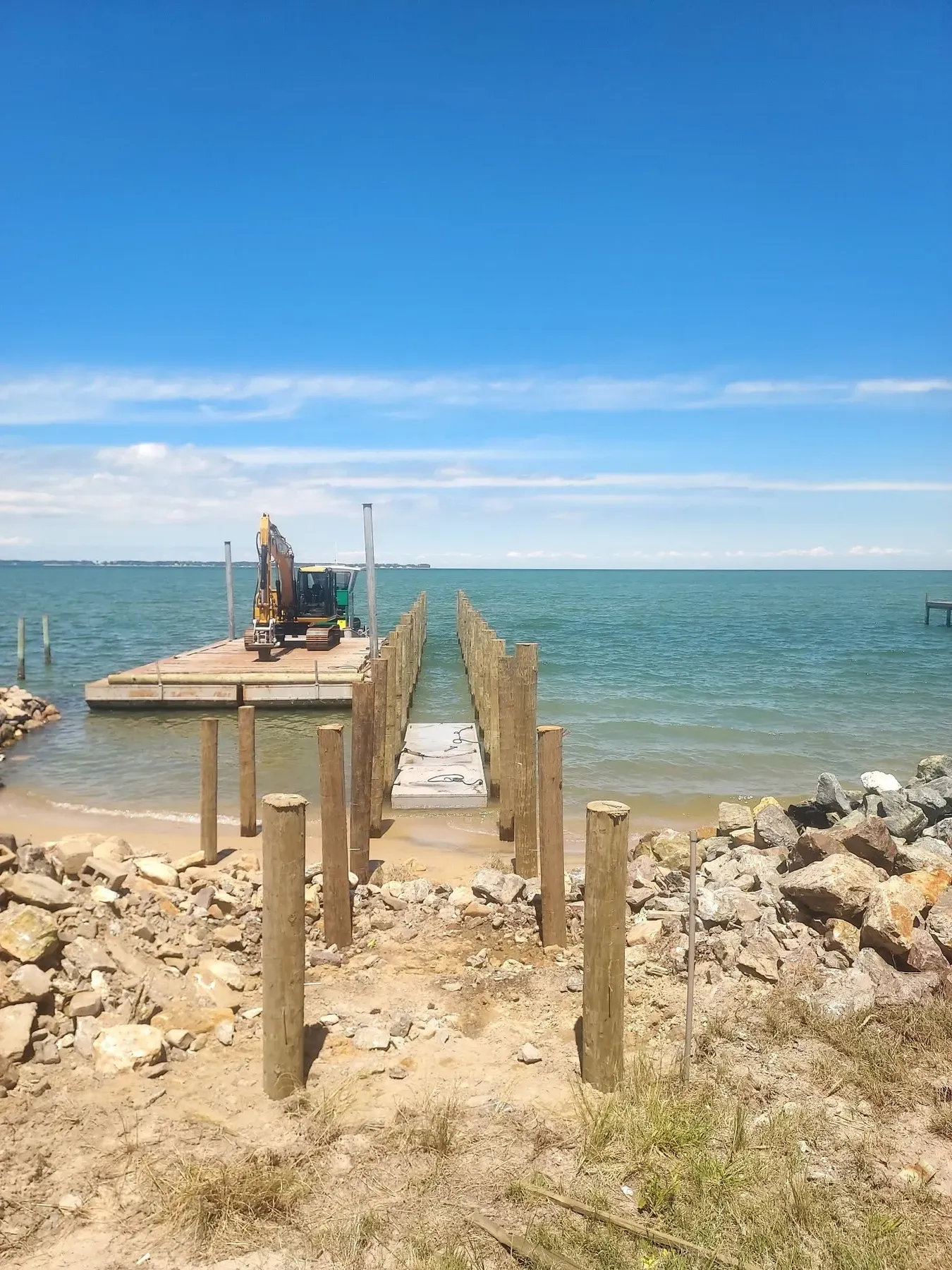 Pier under construction with the barge at its end
