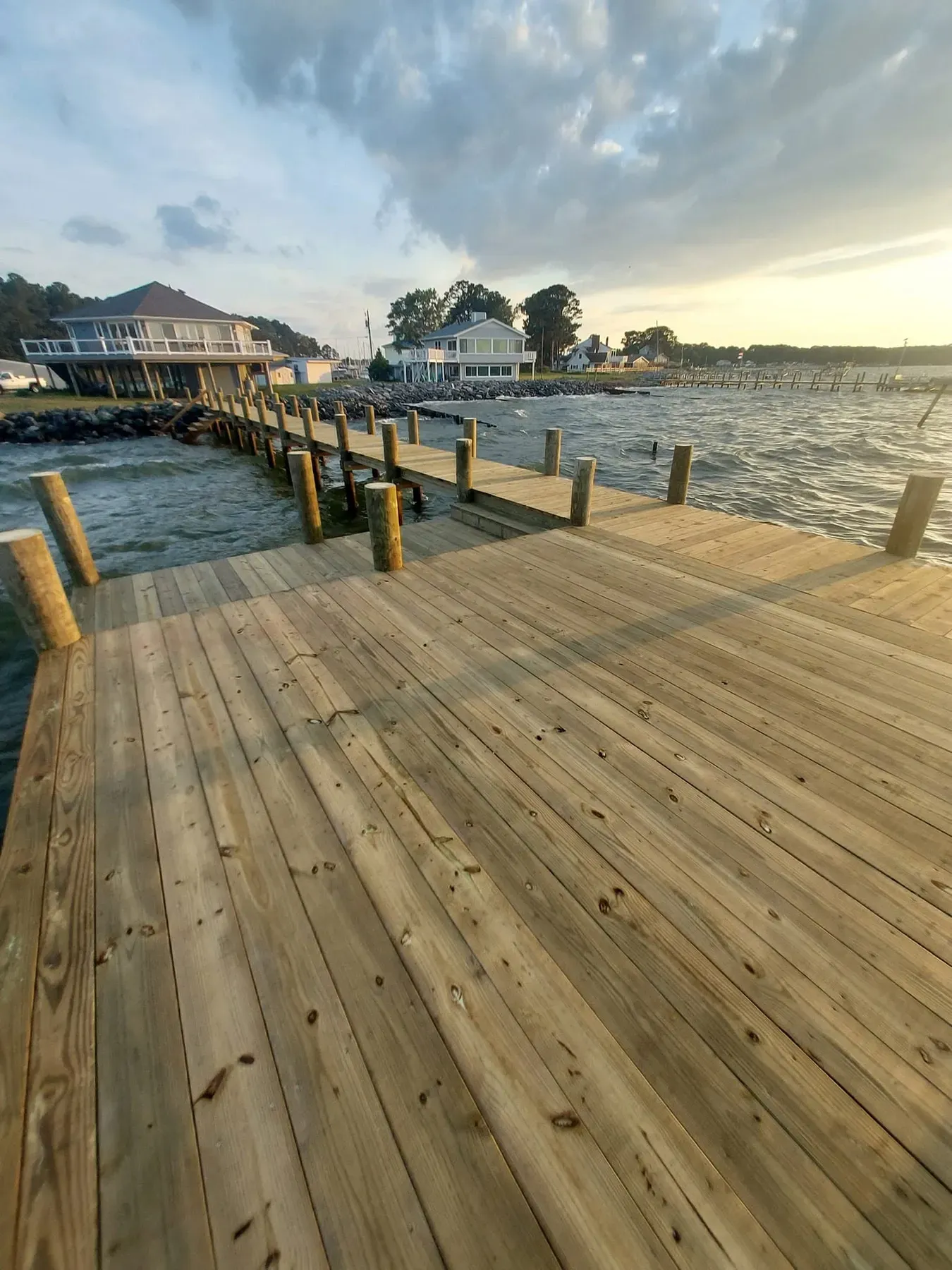 Fresh pier decking leading toward the water