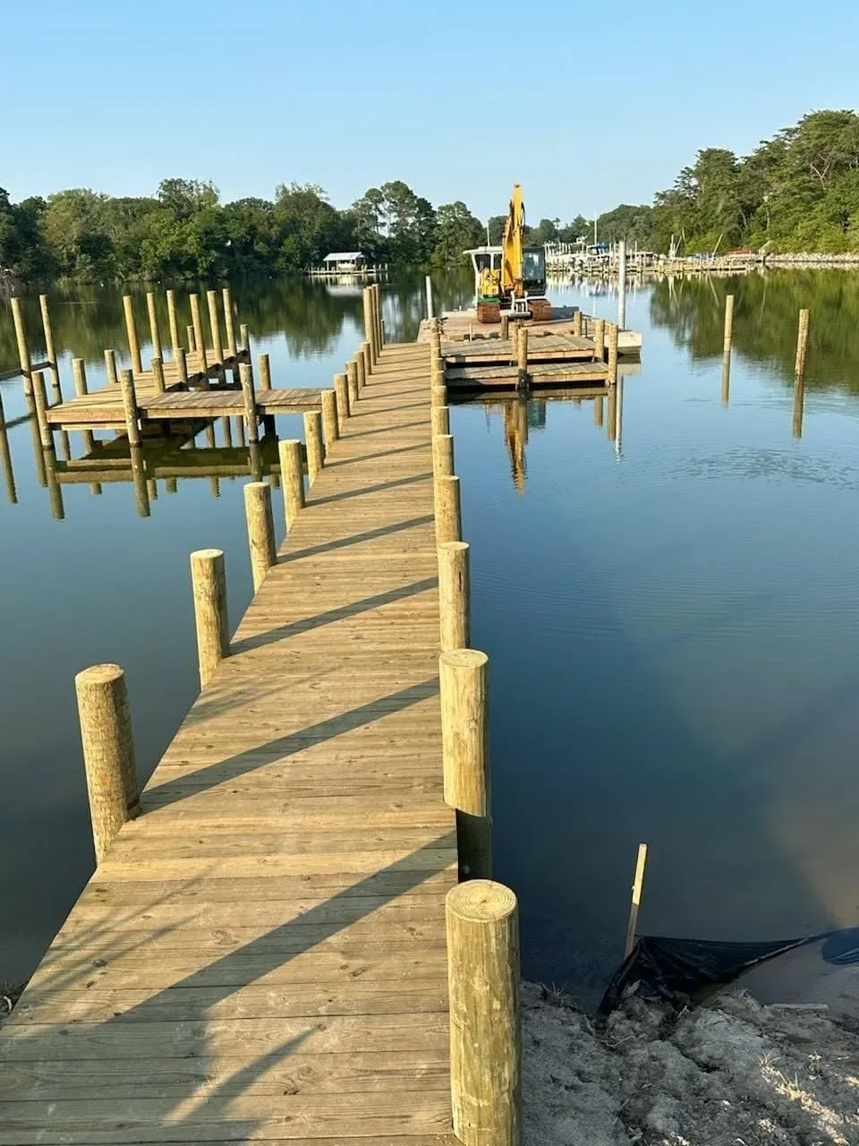 Long new pier with the barge working at its end