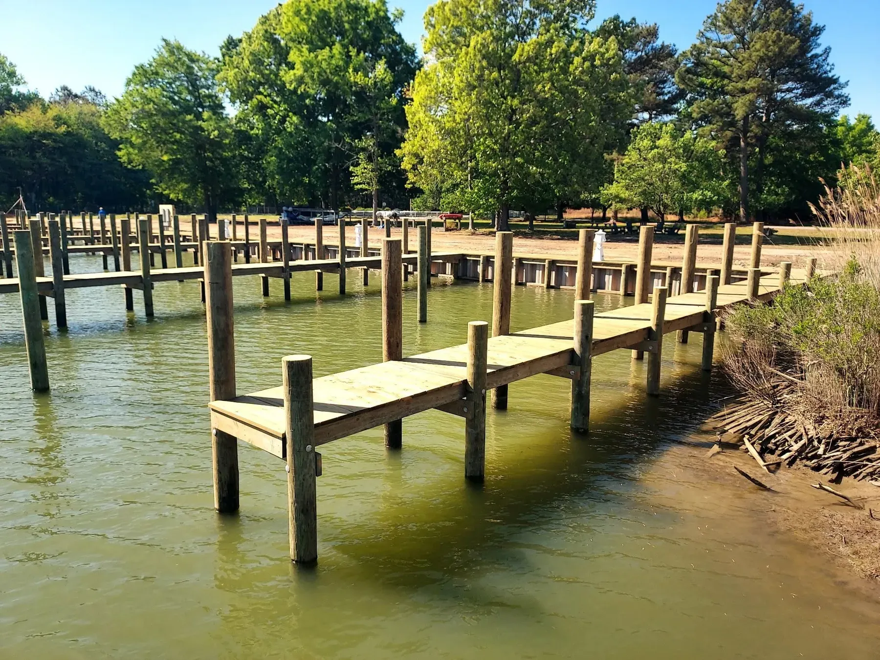 New pier on fresh pilings along a shoreline